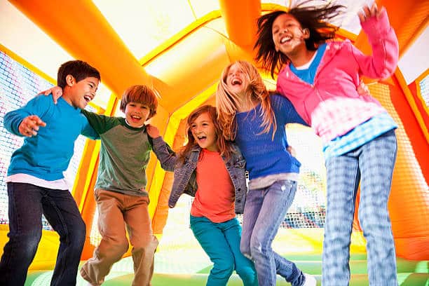 Bouncy House and Smiling Kids